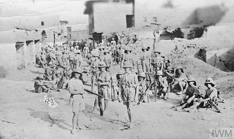 Recapture of Kut-al-Amarah, 24 February 1917. British infantry resting in town.  IWM